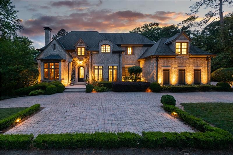 Sophisticated elegance best defines this elegant gated estate.With its high ceilings, natural light, hardwoods and many architectural details, the open floorplan lends itself easily to gracious entertaining or everyday living. Master suite on main with his/her baths and closets. Beautiful newly updated kitchen. ELEVATOR to all 3 levels. Nanny suite accesses off kitchen w/ separate entrance. Terrace level is a world of its own w/home theater, gym with spa bath/sauna, steam and jacuzzi, bar, billiard room. Heated pool w/waterfall. 3 car garage. Quiet cul de sac location.