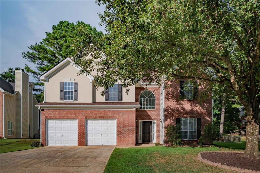 Tucked away near the end of a quiet cul-de-sac, 455 Crafton Ct offers the perfect balance of comfort, space, and convenience. This beautifully updated brick-front home features a welcoming open layout with fresh paint, new luxury vinyl flooring, and abundant natural light throughout. The kitchen has been thoughtfully remodeled with modern countertops and flows seamlessly into the main living areas—ideal for entertaining. Upstairs, you’ll find five spacious bedrooms, while the main level includes a versatile bonus room that could easily be used as a guest bedroom or office, with space available to add a full bathroom. Major systems have been recently updated, including a 7-year-old roof, water heater (2019), and HVAC units (2019 & 2020), offering peace of mind for years to come. Enjoy a long driveway for ample parking and a beautifully landscaped backyard perfect for relaxing or hosting. All this in a prime location just minutes from Kroger, Costco, H-Mart, Walmart, top-rated schools, and Northside Hospital. A wonderful opportunity in one of Lawrenceville’s most convenient and peaceful neighborhoods.