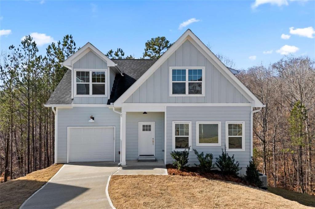 This stunning NEW CONSTRUCTION home is a true charmer, featuring elegant Board and Batten accents that enhance its inviting curb appeal. Offering 3 bedrooms and 2.5 baths, this home is designed for both style and functionality. Step inside to an open-concept living space filled with natural light from an abundance of gorgeous windows. The seamless flow from the living area to the dining space and kitchen makes it perfect for entertaining. True hardwood floors run throughout, while the bathrooms and laundry room are beautifully finished with tile. The bright and airy kitchen boasts a large island, white soft-close cabinetry, stainless steel appliances, and a charming Butler's Pantry with prep and display space, along with an impressive walk-in pantry. A convenient half bath is also located on the main level. The tandem garage features an epoxy-coated floor for durability and style, and just inside, a small drop zone adds extra convenience. Upstairs, you'll find three spacious bedrooms, including the Primary with a generous walk-in closet that flows into the Primary Bath, complete with a large tiled shower and double vanity. A tiled tub/shower combo serves the secondary bath, while a spacious laundry room adds ease to everyday living. The full unfinished basement provides endless possibilities for customization. Don't miss the chance to make this beautiful home yours. Priced BELOW appraisal!