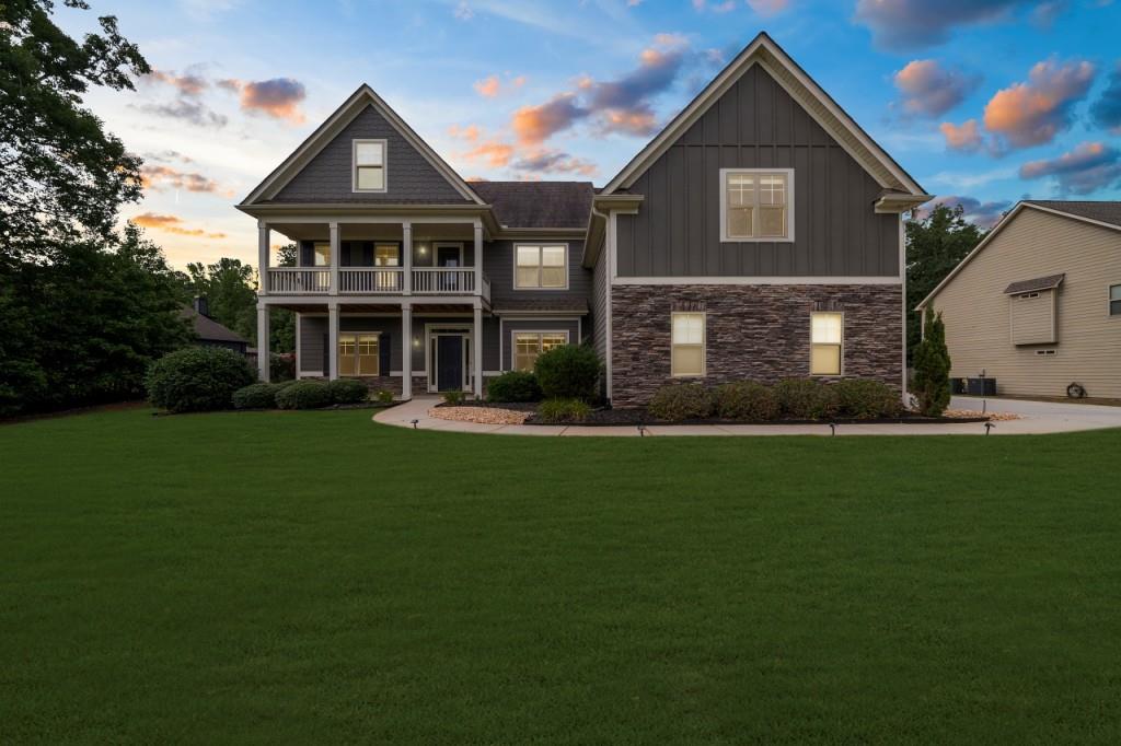 This home should not be priced this low. At $689,900, you're stepping into a $730K+ lifestyle for less only because an unexpected relocation forces the sale. Your gain is their loss. Nearly an acre in Herring Farms holds this 5BR/4BA Craftsman with 4,369 sq ft of elegance, soaring 10-foot ceilings, new flooring, fresh paint, and a marble waterfall master shower. The chef's kitchen flows seamlessly to a screened porch and outdoor fireplace overlooking a private, fenced retreat. Bonus room, office, and flexible spaces fit every season of life. Top schools. Easy Atlanta access. Homes like this don't get discounted until now.