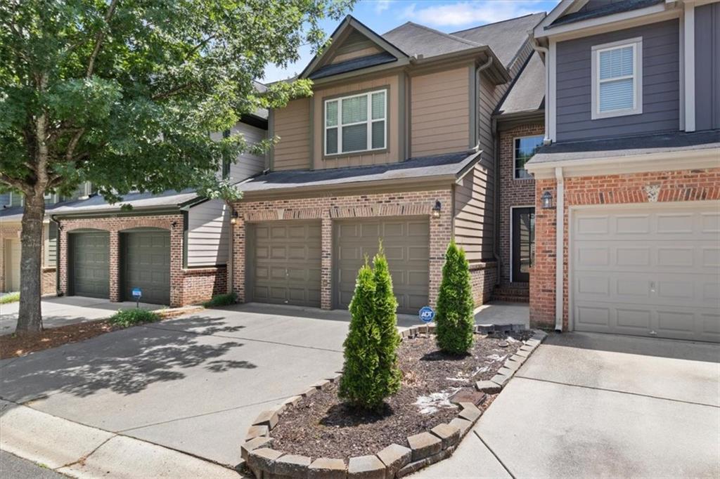 Live where lifestyle meets convenience! This beautifully updated, move-in ready 3BR/2.5BA townhome is nestled in a quiet, gated community just minutes from The Battery, Truist Park, Smyrna Village, and historic Marietta Square.
Step inside to find a bright, open layout with arched entryways, newly installed hardwood floors, and a spacious dining area perfect for entertaining. The chef’s kitchen features granite countertops, stainless steel appliances, an eye-catching backsplash, and an oversized island with seating.
The sunlit family room offers a cozy stone fireplace and a seamless flow for everyday living. Upstairs, the primary suite boasts a tray ceiling, hardwood floors, a spa-style bath with double vanities, updated tile, walk-in closet, soaking tub, and a separate shower.
Two oversized secondary bedrooms overlook a serene, wooded backdrop and share a convenient upstairs laundry. Enjoy morning coffee on the private patio or take advantage of the community’s resort-style pool just steps away. Additional perks include a two-car garage with epoxy flooring and a private outdoor storage room.
This low-maintenance home checks every box: location, layout, and lifestyle. Don’t wait — schedule your showing before it’s gone. Professional photos coming 6/21.