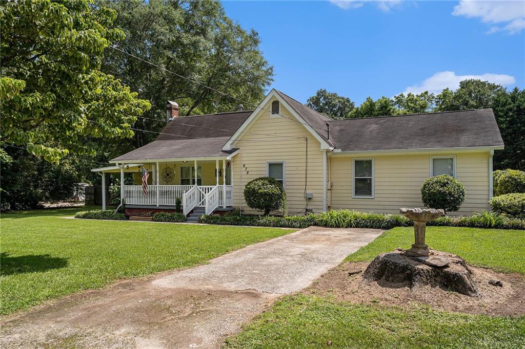 Live within walking distance to downtown Locust Grove landmarks. Sit on the front porch and enjoy this peaceful downtown area. This 4 bedroom 2 bath home with a bonus room that could be a 5th bedroom has endless possibilities. Newer carpet throughout the bedrooms and living room with wide hallways. The large master has its own deck and is open to the fenced back yard. Nice workshop with plenty of storage in the back. Plus an above ground pool. This house has endless possibilities.
