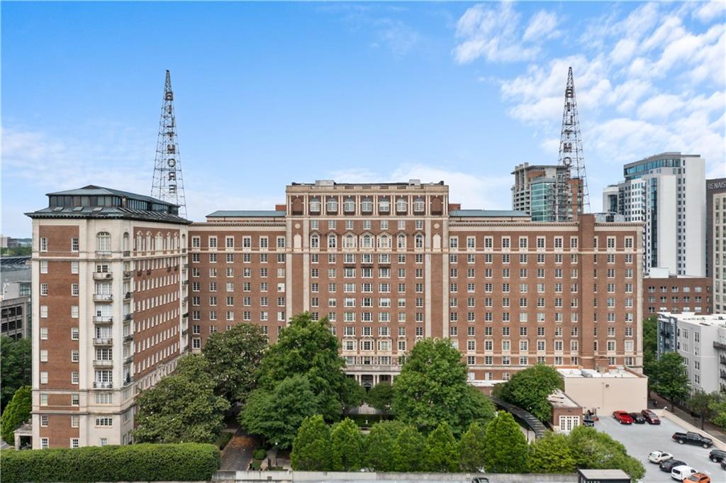 This luxurious 1 bedroom, 1 full bathroom, and 1 powder bathroom condominium in the historic Biltmore House is a must-see! This historic building was built in 1924 and is a stunning example of the city's early architecture. Its majestic facade and ornate finishes provide a timeless elegance to this beautiful residential complex. Each unit is unique in its own right. This unit features stunning hardwood floors throughout, bright natural light pouring in from the abundant windows, and beautiful archways. The open kitchen boasts stainless steel appliances, white cabinets, and a large island perfect for preparing delicious meals. The kitchen overlooks a large dining area perfect for entertaining family and friends. The spacious primary bedroom features charming bay windows that provide stunning views of the city. This bedroom has a private ensuite bathroom with a double vanity and a large shower/tub combo. The Biltmore House is rich in history and is one of Atlanta's most beloved landmarks. From its grand lobby to its lush courtyard, this historic building is sure to take your breath away. Enjoy the convenience of being just steps away from the MARTA station, as well as some of Atlanta's best attractions. Explore the world's largest aquarium, the Georgia Aquarium, or catch a show at the Fox Theater. Shop at the iconic Underground Atlanta, or take a stroll through Piedmont Park. This condo is the perfect place to explore all that Atlanta has to offer!