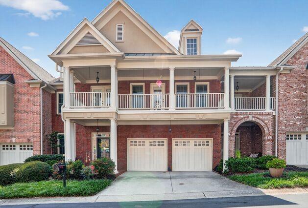 Stunning New Orleans style GATED townhome with an ELEVATOR shaft! This rare floorplan in Ashworth feels like a single family home. Very spacious with an office/living room on the main, banquet size dining room and renovated kitchen opens into the fireside family room with lovely views of the private patio and garden. Lovely kitchen with stone countertops, island, double oven and breakfast bar counter. 10' ceilings throughout the main level, wall of windows along the kitchen and family room and gorgeous hardwood floors throughout. Elegant half bath on the main. The dreamy Owner's suite is truly a gem with a large fireside sitting area, custom walk-in closet and an amazing spa-like bathroom with expansive leather granite countertops, glass frameless shower, jacuzzi tub, glass wall shelves, and stunning iron mirrors! The laundry room is right next door equipped with a washer and dryer. Two more large secondary bedrooms with ensuite bathrooms and walk-in closets. This gated community offers an elevated lifestyle, surrounded by Dunwoody Village with all the new shops and restaurants, Spruill Arts Center, Dunwoody library and close proximity to Perimeter Mall, Marta station, GA 400 and 285. It epitomizes sophistication and convenience. New roof 2020 and new anderson windows 2025!