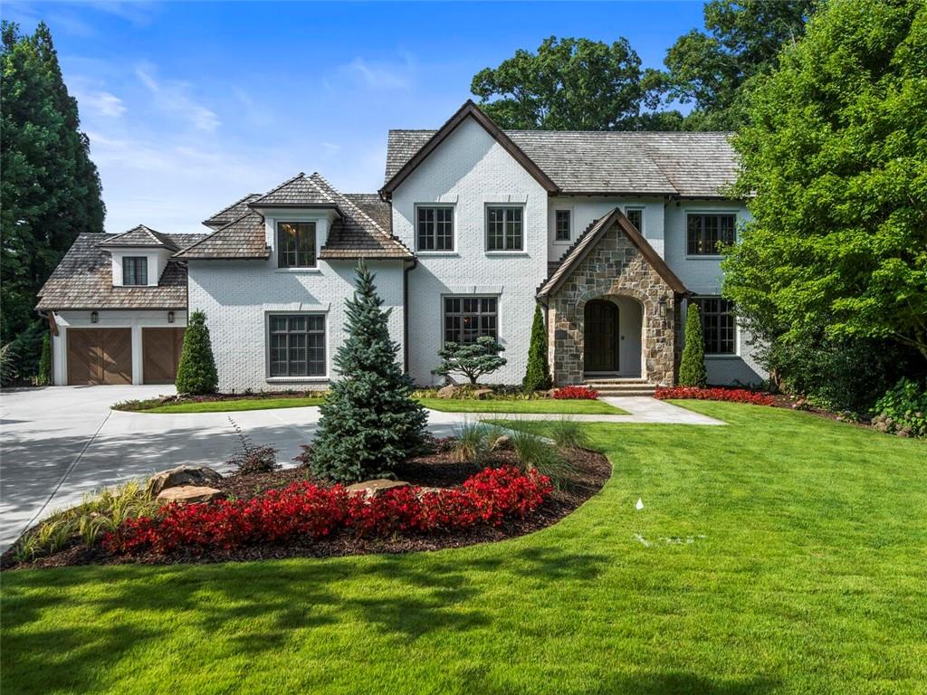 Exceptional in every way, this gorgeous home is sited in a small, private cul-de-sac neighborhood, just steps to all the amenities of Chastain Park! Designed by Architect T. S. Adams and beautifully renovated by Eumenean Construction, one of the City's finest builders, the home provides three gorgeous levels on a professionally landscaped/hardscaped lot with private backyard pool, spa, outdoor shower and entertaining area with stone fireplace and outdoor kitchen. Foyer opens to Formal Living Room with fireplace by Francois & Co; Formal Dining Room and Butler's Pantry with full-size wine-cooler; Paneled Study; State-of-the-Art Waterfall Marble Kitchen and private Catering Kitchen, open to Keeping Room with stone fireplace and pentagon-shaped Breakfast Area. Deck wraps around rear of main level with Covered Porch and Screened Porch opening from the common areas. Master on Main offers a stunning Marble Bath with incredible shower. 4-Car Garages and Mud Room. A gracious front staircase and rear staircase access the upper level with Four lovely Secondary Bedroom Suites and large unfinished Attic. Fabulous Terrace Level provides a huge Recreation Room, Game Room with Wet Bar, Wine Cellar, Home Theater, Bonus Room (excellent office), Exercise Room or 6th Bedroom, Full Bath, Powder Room and Screened Porch. Thoughtfully designed throughout with the finest finishes and fixtures, steel doors and windows, pretty hardwood floors, custom walk-in closets, top-of-the-line appliances, substantial storage, SmartHouse system, sound system, water defense and radon mitigation systems . . . a masterpiece home!