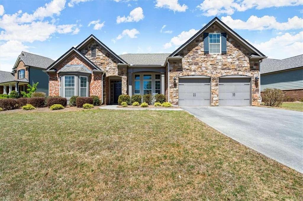 Gently lived-in 3 bed room, 2 bath room home with an oversized sunroom and bonus room upstairs. Hardwood floors throughout the entire house. Kitchen boasts stone countertops. All bedrooms located on main level. Neighborhood has swim/tennis, pickleball court, playground and clubhouse.