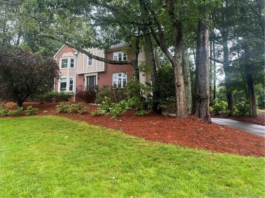 East Cobb Gem with Great Potential! Welcome to 3298 Robinson Oaks Way NE, where quality and timeless charm meet in the heart of East Cobb. This meticulously maintained four-bedroom, two and a half-bath home offers 3,230+/- square feet of beautifully updated living space in a peaceful, optional-HOA community with easy access to Pope High School and Hightower Trail Middle School. Venture inside to find new hardwood floors in the foyer and den, a warm and inviting kitchen with granite countertops, tile flooring, and stainless steel appliances including a gas cooktop, oven, microwave, and refrigerator. The living and dining rooms have light and bright windows with ample space for entertaining. The living room would make a perfect office space for someone who works from home as it does have a door for privacy. Upstairs, you'll love the updated primary bathroom with granite counters, new fixtures, and heated tile floors - complete with a large glass enclosed shower and a soaking tub. The hallway bathroom for the secondary bedrooms has a vanity area with a door to the shower and toilet space. Most rooms feature plantation shutters and the house has new windows for energy efficiency and style. The finished basement includes an office along with a second office space outfitted with a clothes rack perfect for remote work or additional storage. The drive under garage has ample space for additional storage as well. Outside, enjoy your private retreat with new stonework along the walkway and driveway, a custom stone patio with fireplace, lush new landscaping including azaleas and Leland cypresses. Located in the highly sought-after East Cobb area, this home offers easy access to top schools, parks, and shopping.