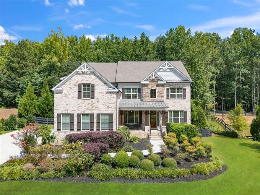 MODERN FARMHOUSE ESTATE WITH POOL AND PRIVATE GATED ENTRY:
Welcome to Milton’s premier lifestyle—where modern design meets timeless comfort. This 6-bedroom, 6-bathroom modern farmhouse estate is thoughtfully designed for both relaxed everyday living and resort-style entertaining. Set on over an acre behind a private, video-monitored gate in one of Milton’s most desirable luxury communities, the home offers a rare combination of privacy, community, and sophistication.
Spanning 6,000+ square feet, the interiors feature soaring 18-foot ceilings, abundant natural light, and curated finishes throughout. For those seeking turnkey convenience, the brand-new designer organic-modern furnishings are also available for purchase.

Highlights
• Chef’s kitchen with oversized island & premium appliances.
• Six en-suite bedrooms, including a spa-inspired primary retreat with an oversized closet and abundant storage.
• Updated bathrooms with quartz counters & designer hardware.
• Great room with dramatic 18' ceilings and walls of windows.
• Resort-style private pool & spa with outdoor kitchen.
• Wood floors in main living areas & plush new carpet in bedrooms.
• Modern lighting and fixtures
• The gorgeous furnishings are available for purchase.


Designed for both versatility and connection, the basement offers three expansive areas with unlimited options. A stylish wet bar makes hosting effortless, while the full bedroom and bath ensure guests feel right at home. With direct exterior access to the resort-style pool, every celebration flows seamlessly outdoors—perfect for gatherings that will be remembered for years to come.

Perfectly situated along one of Milton’s most desirable estate corridors, this home is just minutes from top-rated schools, premier dining, and golf. Enjoy quick access to Halcyon, Downtown Alpharetta, Avalon, and Vickery Village. Optional membership at The Manor Golf & Country Club provides access to tennis, social events, and the broader ClubCorp network, including White Columns and Polo Golf & Country Club.
Whether your map sets you in Alpharetta or Milton, this estate delivers the best of both—an unbeatable location paired with a luxury lifestyle.