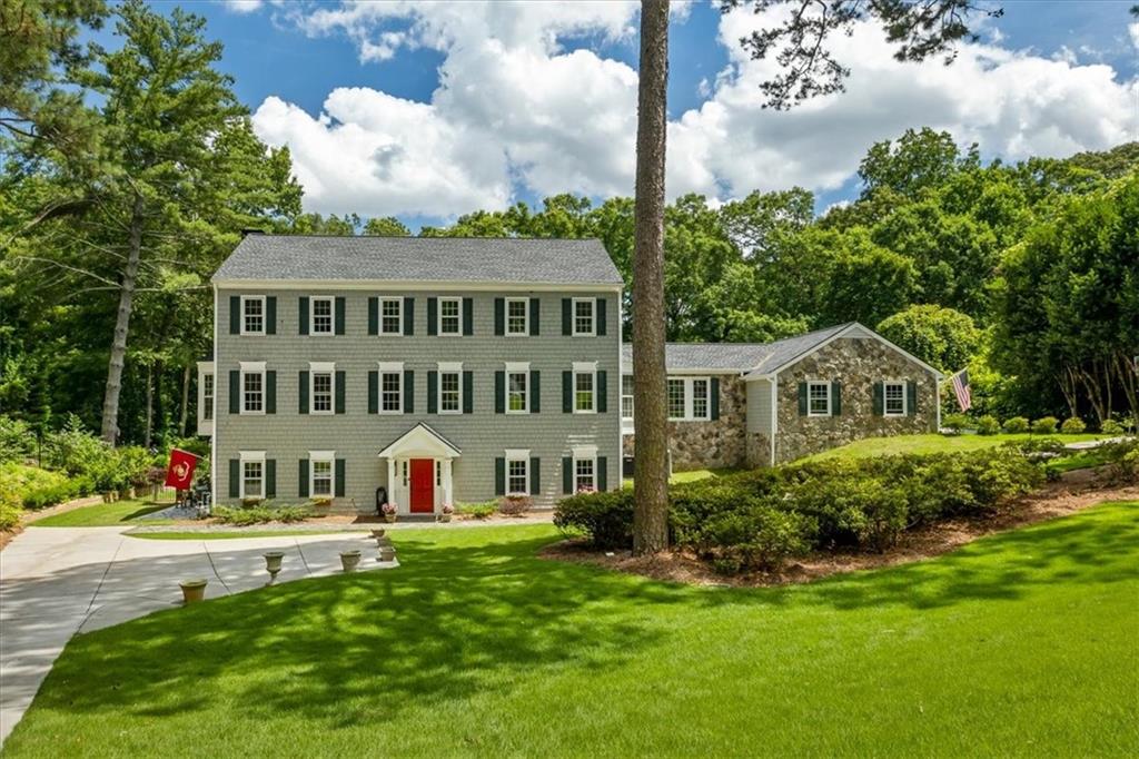 Discover this exceptional Beautiful Home situated in the highly desirable Rivergate neighborhood. This private 1.5-acre lot offers a beautiful resort-like backyard and pool. The elegant classic foyer leads to a full finished living space/apartment including a cozy family room with backyard views and an independent kitchen & Laundry unit , followed by 2 bedrooms suitable for extended family and guests. With extra office space. As you ascend to the second level you will marvel at the sophisticated layout and spatial design. A range of welcoming areas characterizes this level including the comfortable room/office and the family room ,featuring a wood-burning fireplace. The living room merges into the sitting room and then into the oversized dining room which together creates a fluid pathway to the newly redesigned kitchen. The kitchen combines stainless steel appliances with quartz countertops and grey subway tile backsplash to create both functionality and style. The kitchen features a 6+ burner 48" Fulgor Italian double oven as its focal point. You transition into your exclusive sanctuary where the experience of resort living becomes tangible. The 60x30 pebble Tec pool beckons you to experience both a refreshing swim and some peaceful relaxation. The expansive grassed backyard provides the perfect setting for outdoor gatherings and the screened-in porch from the den with a large new deck creates an uninterrupted transition from inside to outside. The yard features three extra outbuildings at its rear. These outbuildings can become an ideal outdoor cabana for entertaining pool guests or a private gym. The kitchen level features a side entry garage with room for two vehicles designed to maximize your convenience and accessibility. Owner has completed a huge list of upgrades in the property. Residents will find shopping centers, dining options, schools, the Dunwoody Country Club and major interstates within just a few minutes.