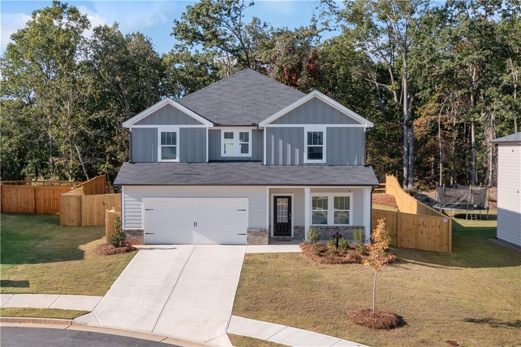 Come home to this 4 bedroom, 2-1/2 bath Newly built, energy-efficient home! This home is settled on a cul-de-sac lot that backs up to the HOA green space and Nature Preserve. The open floor plan is perfect for entertaining family and friends.  The kitchen offers custom cabinets with pull out pots and pans organizers, walk in pantry and an eat at island overlooking the large family area. Also on the main level is a flex space perfect for a home office or small gym.  Upstairs, the oversized primary suite has a private sitting area, large primary master bath with custom shower, large walk in closet and double vanity, three additional bedrooms, additional bath, laundry room and multiple linen/storage closets.  The private back yard is fenced and the covered patio is a great grilling space in any weather.  This master-planned community offers plenty of amenities including swimming pools, tennis courts and playground. Go fishing at Hickory Log Creek Reservoir, located right outside the main entrance to the community, or go golfing at the nearby Fairways of Canton. This home was built with innovative, energy-efficient features designed to help you enjoy more savings, better health, real comfort and peace of mind. All appliances including the new refrigerator, washer and dryer are included with this property. Builder warranty is good through March 2025.