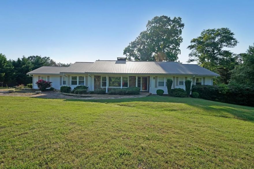 Discover the comfort and versatility of this ranch home on a basement, set on a flat, one-acre lot with no HOA restrictions. The spacious kitchen features updated countertops, a tile backsplash, wooden cabinets, and stainless steel appliances ideal for both everyday living and entertaining. A sunroom offers relaxing views of the private backyard. The upstairs living space has three bedrooms and two full baths. Inside, you'll find an oversized primary bedroom and a comfortable, functional layout. The finished basement includes a full kitchen with a stove and refrigerator, a full bathroom, and laundry hookups making it perfect for an in-law suite or potential rental income. The one-acre lot also offers excellent potential for building an additional home, making it an ideal opportunity for future development or multi-generational living. This property includes access to a sewer easement, providing options for future utility connection. Home is unrestricted.