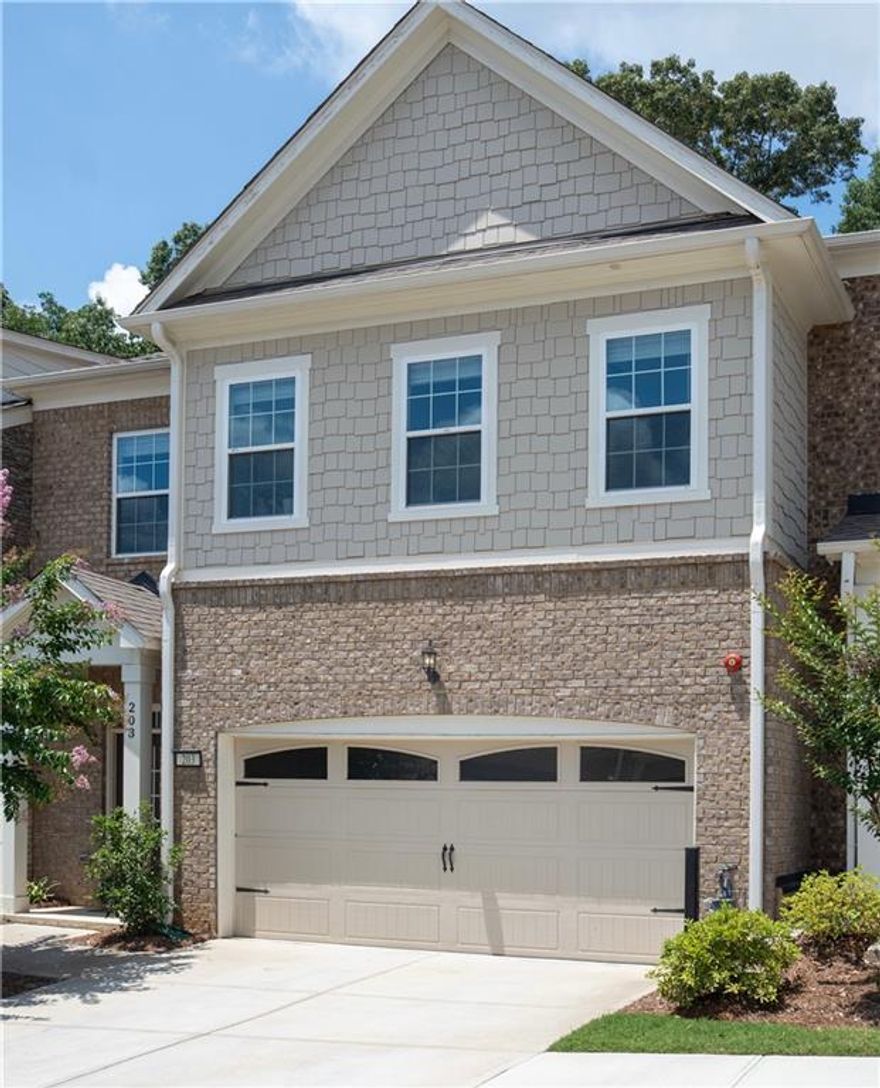 Stunning Upgraded Townhome in Sought-After Community Minutes from Downtown Woodstock! Welcome to this meticulously maintained 3-bedroom, 3.5-bath townhome, perfectly located just minutes from the vibrant heart of downtown Woodstock. Situated in a highly desirable neighborhood with fantastic amenities including a sparkling pool and pool house, this home offers the best of comfort, convenience, and style. Step inside to an the open-concept layout that seamlessly connects the gourmet kitchen to the expansive great room, creating the perfect space for entertaining or relaxing in style. Enjoy a spacious dining room ideal for hosting gatherings, all enhanced by abundant natural light and upscale finishes throughout. Enjoy gorgeous hardwood flooring on every level, an inviting shiplap-accented entryway, and a beautiful brick fireplace with mantle—ideal for cozy evenings. The gourmet kitchen is a chef’s dream, featuring upgraded white cabinetry and hardware including under cabinet lighting, spacious kitchen island with top-level granite countertops, cafeteria style backsplash, direct vent hood, and stainless steel appliances. Retreat to the spacious primary suite with its own private balcony and a luxurious en-suite bath showcasing an extended walk-in shower with high-end designer tile and soaking tub. Boasting spacious secondary bedrooms, each complete with its own private en-suite bathroom and generous walk-in closet, each bathroom is tastefully appointed with premium finishes, upgraded cabinetry and shower tile work to the ceiling. The private, fenced backyard offers a peaceful outdoor space perfect for relaxing or entertaining. This home truly has it all—location, luxury, and low-maintenance living. This stunning townhome boasts over $60,000 in upgrades — a full list of enhancements is included in an attachment. So don’t miss your opportunity to own, live, and enjoy being  in one of Woodstock’s most desirable communities !!!