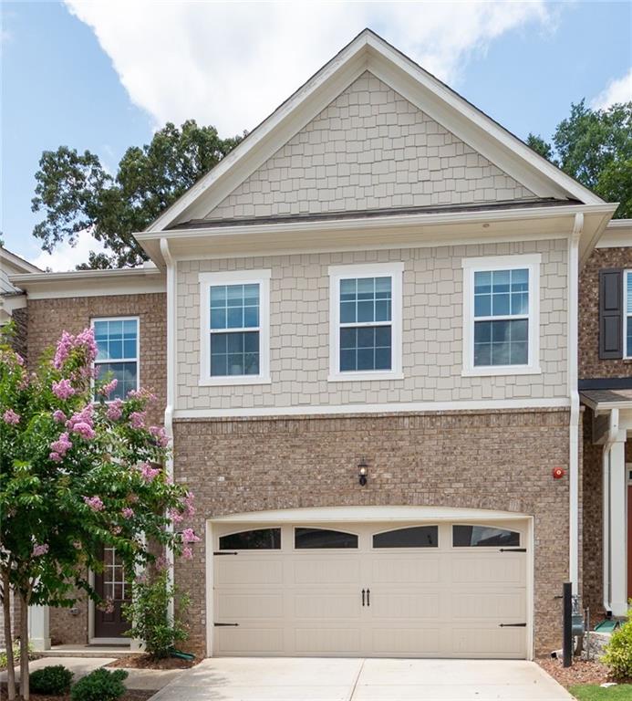 Stunning Upgraded Townhome in Sought-After Community Minutes from Downtown Woodstock! Welcome to this meticulously maintained 3-bedroom, 3.5-bath townhome, perfectly located just minutes from the vibrant heart of downtown Woodstock. Situated in a highly desirable neighborhood with fantastic amenities including a sparkling pool and pool house, this home offers the best of comfort, convenience, and style. Step inside to an the open-concept layout that seamlessly connects the gourmet kitchen to the expansive great room, creating the perfect space for entertaining or relaxing in style. Enjoy a spacious dining room ideal for hosting gatherings, all enhanced by abundant natural light and upscale finishes throughout. Enjoy gorgeous hardwood flooring on every level, an inviting shiplap-accented entryway, and a beautiful brick fireplace with mantle—ideal for cozy evenings. The gourmet kitchen is a chef’s dream, featuring upgraded white cabinetry and hardware including under cabinet lighting, spacious kitchen island with top-level granite countertops, cafeteria style backsplash, direct vent hood, and stainless steel appliances. Retreat to the spacious primary suite with its own private balcony and a luxurious en-suite bath showcasing an extended walk-in shower with high-end designer tile and soaking tub. Boasting spacious secondary bedrooms, each complete with its own private en-suite bathroom and generous walk-in closet, each bathroom is tastefully appointed with premium finishes, upgraded cabinetry and shower tile work to the ceiling. The private, fenced backyard offers a peaceful outdoor space perfect for relaxing or entertaining. This home truly has it all—location, luxury, and low-maintenance living. This stunning townhome boasts over $60,000 in upgrades — a full list of enhancements is included in an attachment. So don’t miss your opportunity to own, live, and enjoy being in one of Woodstock’s most desirable communities !!!