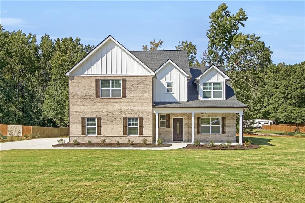 NEW CONSTRUCTION – Move-In Ready in McDonough! Discover this brand-new contemporary-traditional home offering 5 bedrooms, 3.5 baths, and an open-concept design that blends modern style with everyday comfort. Situated on a rare .9-acre lot in an upscale, quiet community with NO HOA, this property provides the perfect mix of privacy, space, and convenience. Step inside to find a bright, inviting interior featuring a main-level in-law suite with private bath, plus an additional half bath—ideal for guests or multi-generational living. The chef’s kitchen showcases 42” white cabinets, quartz countertops, stainless steel appliances, a large center island, and direct views into the great room. The living area is anchored by a sleek, multi-colored remote-controlled electric fireplace, creating the ultimate gathering space. Upstairs, retreat to the luxurious primary suite with 9’ tray ceilings, a spacious walk-in closet, a dual vanity, and a glass-enclosed shower. Additional bedrooms are generously sized, offering flexibility for family, office space, or hobbies. This home is designed with quality and efficiency in mind: Dual HVAC system, Luxury vinyl plank flooring on the main level, Premium finishes throughout, Built by MAR Investments Inc., a boutique builder known for attention to detail. Warranties & Buyer Benefits: 2-10 New Construction Home Warranty, 1-Year Appliance Warranty, 1-Year Termite Bond, Full Plat Survey Included. Prime Location: Minutes from shopping, dining, schools, and entertainment—close enough for convenience, yet tucked away for peace and quiet. Buyer Incentives: Seller is offering up to $10,000 in buyer concessions plus an additional $2,000 credit with preferred lender, Homestar Mortgage – a Division of American Pacific Mortgage. This home also qualifies for the Georgia Dream Down Payment Assistance Program for eligible buyers. Don’t miss this opportunity to own a move-in ready new construction home in McDonough with no HOA, nearly an acre of land, and unbeatable incentives!