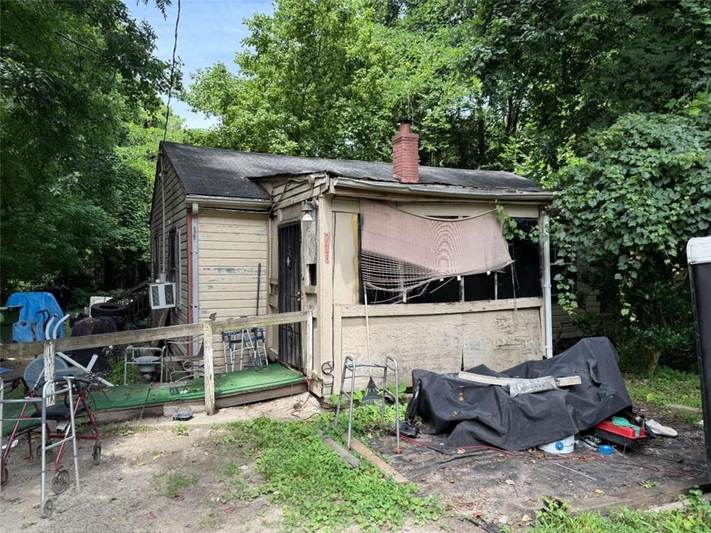 Land with a house, but fire damage will most likely make this a tear down. Sitting on a level .293 acres. Great investment property to build a home for resell or immediate move-in.