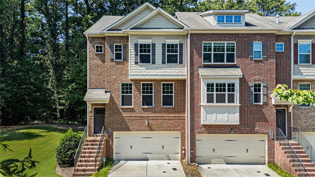 Welcome to 3155 Boldmere, Unit #3 – an end-unit townhome where modern design meets effortless Smyrna living. With only one neighbor, this home gives you the privacy you crave and the space you deserve. And the best part? You’re walking into instant equity – the ultimate win for today’s savvy buyer.
The heart of the home is the 13-foot granite island – perfect for weekend brunch spreads, wine nights with friends, or working from home in style. The gourmet kitchen with stainless appliances and touchless faucet makes every meal feel elevated.
The living room sets the mood with a floor-to-ceiling slate fireplace, upgraded electric insert, and built-in surround sound for immersive movie nights. Custom cabinetry adds a designer touch while keeping everything organized.
Need a space that does it all? The upgraded flex-space features warm wood LVP flooring, surround sound, and a custom queen Murphy bed – instantly transforming it from home office to guest suite.
Upstairs, the primary suite is your private escape with spa-like bath and walk-in closet, and the additional bedroom with its own en suite bath makes hosting guests easy.
Step outside and you’re minutes from Smyrna Market Village, West Village coffee shops, and The Battery’s dining, shopping, and entertainment. Within 1.5 miles of Home Depot, Comcast, Papa John and TEK corporate offices. This isn’t just a home – it’s a lifestyle upgrade, and it’s ready for you right now.