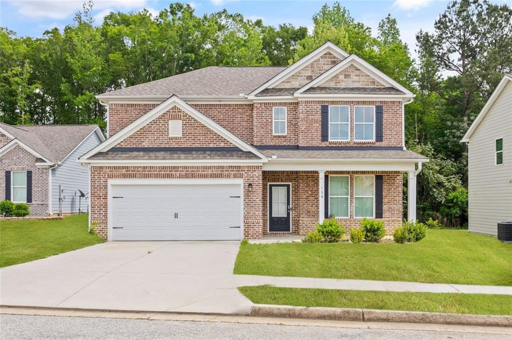 The community is located about 20 minutes from the Atlanta Motor Speedway. This two-story plan will feature a large island in the kitchen including granite countertops and tile backsplash. Kitchen features stainless steel appliances, 36" shaker cabinets with crown trim, and a view to the large family room. LVT flooring on the main floor. Large master bedroom with crown molding and huge walk-in closet. Master bathroom includes tile shower with framed shower door. Granite counters in master bathroom and all secondary bathrooms. Loft. https://apply.link/ZPu81uU