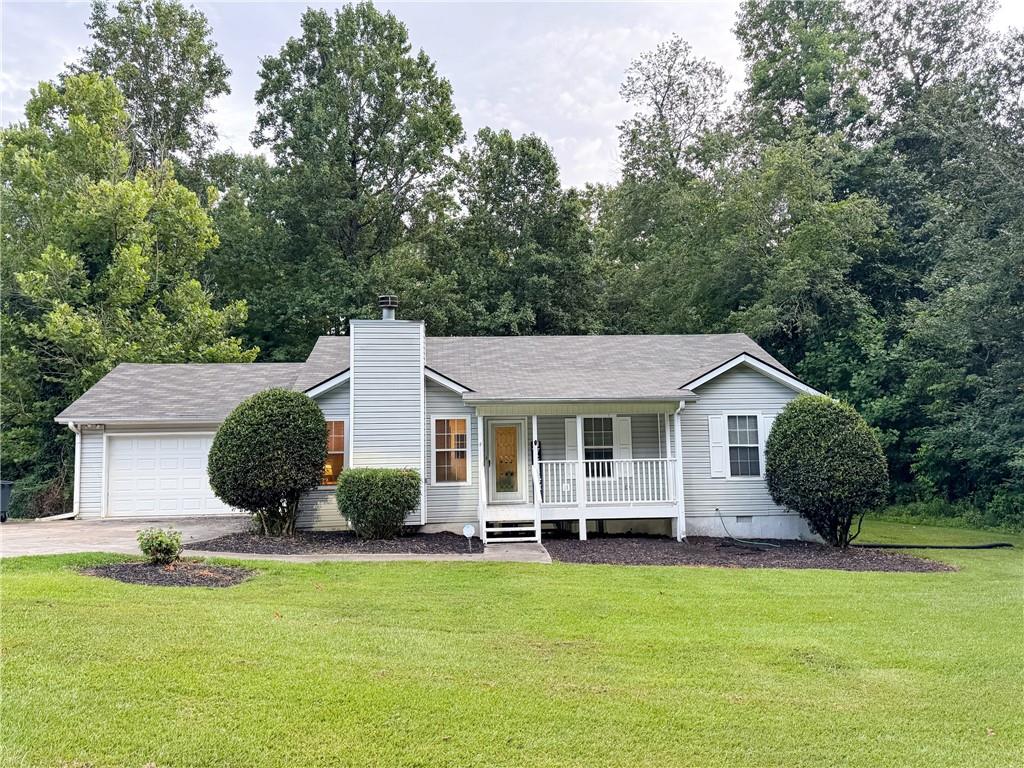Welcome home to this adorable and well-maintained 3 bedroom, 2 bath traditional ranch, perfectly situated on a quiet cul-de-sac lot just under an acre in the heart of Cumming! From the moment you arrive, you'll be charmed by the classic rocking chair front porch and the peaceful, wooded setting that offers privacy and space to enjoy the outdoors. Step inside to a bright and open layout featuring a fireside family room with soaring vaulted ceilings, a separate dining area ideal for entertaining, and a cheerful kitchen with abundant natural light, a convenient cook’s island, walk-in pantry and plenty of cabinetry for storage and all stainless steel appliances including new vent hood!
All bedrooms are located on the main level, offering easy one-level living. The primary suite provides a comfortable retreat with ample space and natural light. One of the standout features of this home is the beautifully enclosed sunroom off the back, with warm wood paneling and tiled flooring—perfect for relaxing with morning coffee or enjoying views of the large, wooded backyard year-round.
Recent upgrades include fresh interior paint, low-maintenance luxury vinyl plank (LVP) flooring throughout the main level, a newer roof and water heater (both only 3 years old), and an HVAC system in attic replaced in 2020. This home combines timeless charm with peace of mind and modern comforts.
The oversized lot offers endless possibilities—gardening, play areas, outdoor entertaining, or simply enjoying the tranquility of your own wooded retreat. Located just minutes from downtown Cumming, Hwy 400, top-rated Forsyth County schools, shopping, parks, and dining—this home truly has it all. Don’t miss your chance to own a private haven with unbeatable convenience!