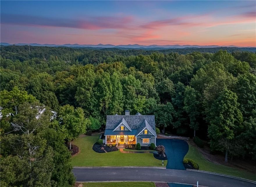 Located in the Sought-After Chestatee Lake & Golf Community

Welcome to 189 Scarlet Oak Lane — a beautifully maintained, designer-finished home situated on one of the largest and most private corner lots in the highly desirable Northeast Cove section of the Chestatee Lake and Golf Community. This stunning Craftsman Cottage is a ranch-style home with a finished terrace level offering the ideal blend of comfort, style, and functionality — perfect for everyday living or entertaining guests.

Key Features:  Like-new cedar shake roof, only 6 years old with a 30-year lifespan-  Two HVAC systems: One brand new, the other well-maintained and only 10 years old-  Open-concept floor plan with soaring high ceilings throughout-  Fully remodeled chef’s kitchen featuring a large center island, gas range with custom hood, high-end stainless appliances, and elegant quartzite countertops and large island-  Designer finishes throughout the home-  Spacious screened-in porch overlooking a private backyard oasis-  Expansive outdoor living space complete with a firepit area — perfect for relaxing or entertaining-  Desirable ranch layout with additional living and guest space on the finished terrace level   Community Amenities:  Great social atmosphere in resort style neighborhood w/ clubs, events, and social committees-  Enjoy the resort-like lifestyle offered by the Chestatee Lake and Golf Community, which includes:  Award-winning 18-hole golf course-  Private marina with boat slips on Lake Lanier-  Clubhouse with restaurant/dining and social events-  Swimming pool & tennis/pickle ball courts-  Bocce Ball Courts-  Walking trails, parks, and playground-  Regularly planned community events and clubs for all ages-  Location & Convenience:  Nestled in the scenic beauty of Dawsonville, this home offers quick access to all modern conveniences:  Just minutes from North Georgia Premium Outlets, Publix, Kroger, and a wide variety of shopping and dining options-  Easy access to GA-400, making commuting a breeze-  Close proximity to Northside Hospital Forsyth, Northeast Georgia Medical Center, and other healthcare providers-  Enjoy nearby attractions including Lake Lanier, Amicalola Falls, and the Dahlonega Wine Country   Top-Rated Schools:   Families will appreciate being zoned for some of the area’s top-rated schools in the Dawson County School District, known for strong academics, athletics, and a supportive community environment.  Don’t Miss This Opportunity!  Whether you're looking for your forever home, a serene lake/golf retreat, or the perfect place to entertain family and friends, 189 Scarlet Oak Lane checks all the boxes. This is a rare opportunity to own a thoughtfully designed, move-in-ready home in one of North Georgia’s most beloved lake and golf communities.  Schedule your private showing and golf cart tour today and experience the Chestatee resort lifestyle!