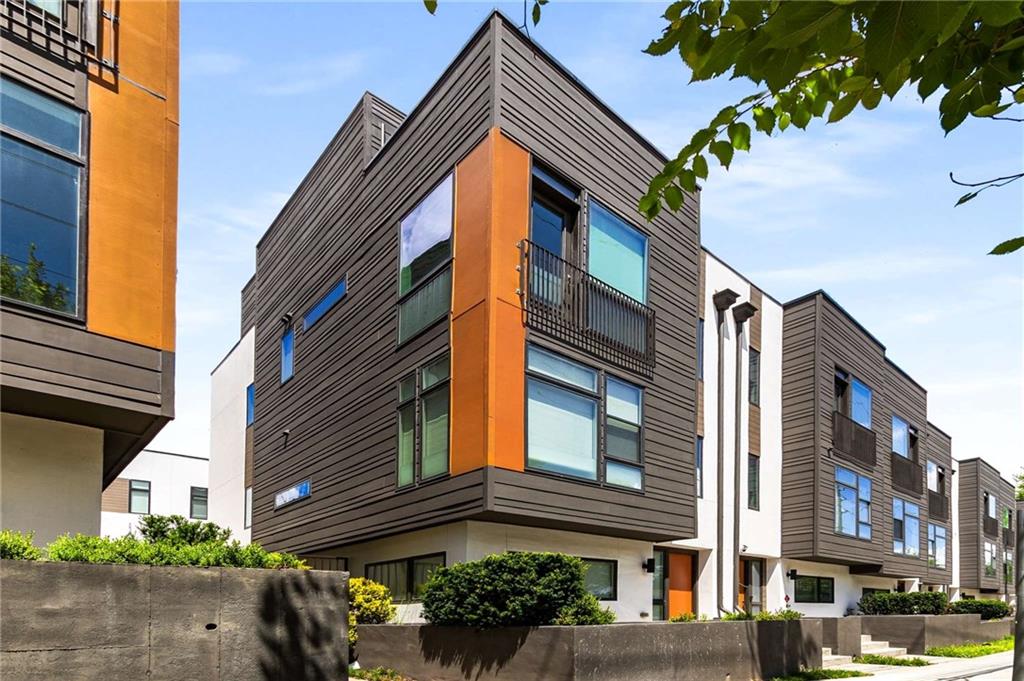 *AVAILABLE NOW FOR LEASE OR LEASE PURCHASE* Welcome to 53 Reynolds Square Ln — a stunning, light-filled corner townhome that puts you in the heart of it all. Perfectly situated between Reynoldstown and Edgewood, this modern gem sits directly across from Edgewood Retail District, offering endless food, shopping, and entertainment options just steps from your front door. The BeltLine, Inman Park MARTA, and Little Five Points are all within walking distance. Inside, enjoy a bright, open layout with soaring 10’+ ceilings, wide plank hardwood floors, and oversized windows throughout. The gourmet kitchen features quartz countertops, designer 42” cabinetry, a full suite of stainless steel KitchenAid appliances (including gas range & double oven), and an expansive island that seats up to eight — ideal for hosting. All three bedrooms are oversized, with ensuite baths and custom closets. The cozy living room, generous storage, and 2-car side-by-side garage with ample guest parking round out the spacious interior. The best part is the private rooftop retreat with a built-in gas firepit overlooking serene treetops and sweeping sunset views — the ultimate spot to unwind or entertain. All appliances included. Modern luxury meets unbeatable convenience — this is city living at its best. Don’t miss it! 680+ credit, 40x rent annually, pets allowed.