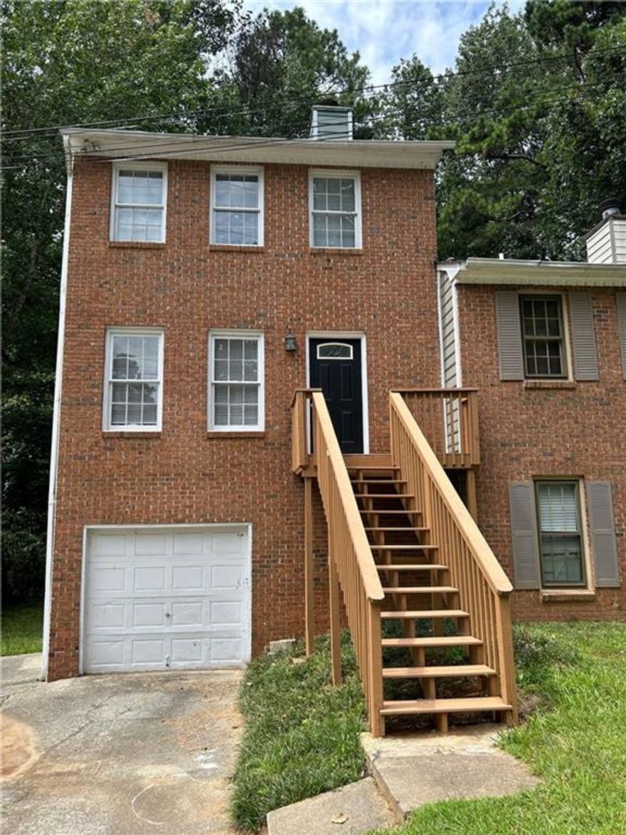 Newly remodeled townhome. Three finished levels. Spacious open and bright. New kitchen and  new paint throughout. Two large bedrooms and two full baths on top floor and two more rooms with living area and full bath in finished basement area. Fireplace in living room.  Large back deck. Great location close to Smyrna and Marietta. Vacant.