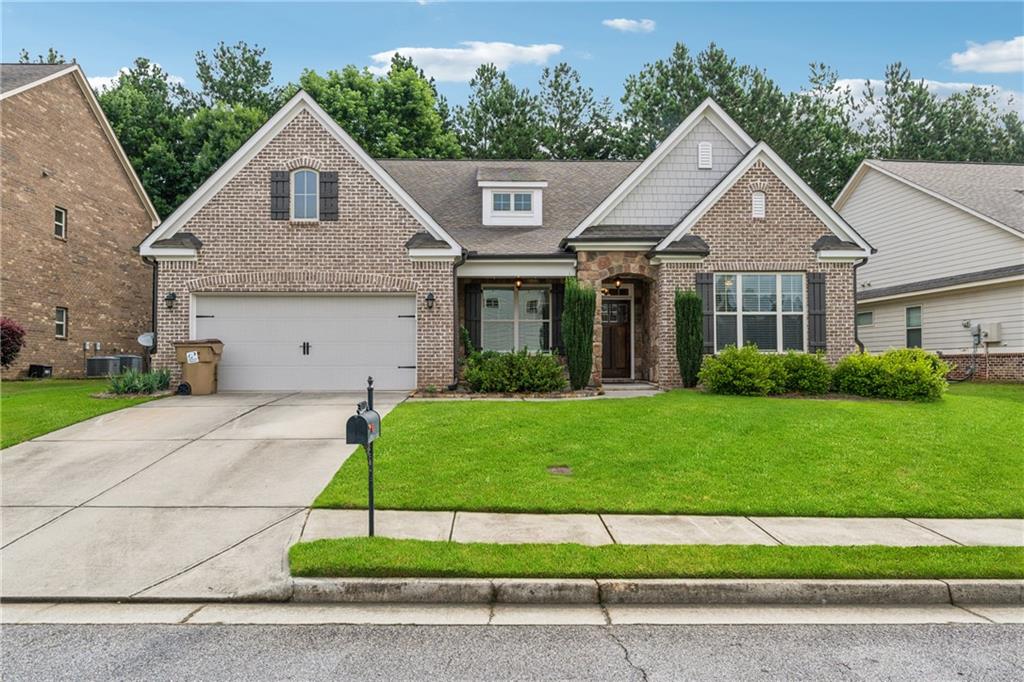 Stunning Home in Sugar Hill / Ashford Crossing.
Welcome to this beautifully designed home that offers the perfect blend of comfort, space, and functionality. The primary suite is conveniently located on the main floor, featuring a luxurious oversized shower with dual shower heads for a spa-like experience. Two additional bedrooms on the first floor make this layout ideal for multigenerational living. Upstairs, you’ll find a spacious fourth bedroom along with a generous bonus room, perfect for a playroom, media room, or guest retreat. The main living areas are open and expansive—perfect for both everyday living and entertaining. A dedicated home office on the first floor offers flexibility for remote work, homeschooling, or a creative studio. At the heart of the home is a large chef’s kitchen with an oversized granite island that comfortably seats six—ideal for casual meals and gathering with friends and family. Step outside to a perfectly sized backyard featuring built-in concrete seating—an excellent space for outdoor entertaining, with plenty of room to add an outdoor kitchen or other custom touches. Let your imagination run wild!
This home offers abundant space, endless potential, and a warm, welcoming layout—all at a price that’s set to move quickly. Don’t miss your opportunity—schedule your showing today!