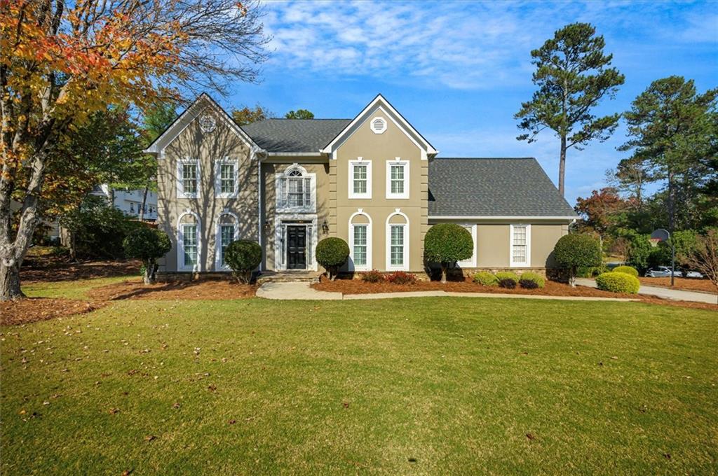 Stunning Home in East Cobb! This spacious 5-bedroom, 2.5-bath residence boasts a perfect blend of comfort, style and modern amenities. As you enter from the foyer, you will find a den/office space with French doors, ideal for work/study, as well as a separate dining room, all with plantation shutters and plenty of light! Hardwoods can be found throughout the main floor as well as stylish lighting. The updated kitchen features modern appliances, a large kitchen island with sink, fantastic counter space (granite), coffee station, incredible cabinet space. A custom built-in shelf and arched doorways set this kitchen apart! The fireside living room with access to the screened porch is the perfect space for relaxing. Head upstairs to the large primary suite which features tray ceilings, plantation shutters and en suite primary bath that has been beautifully renovated with separate shower and soaking tub, offering a relaxing retreat at the end of the day. Two large closets provide plenty of space! Four large secondary bedrooms provide room for all, and a true laundry room can be found in the upstairs hall for maximum convenience. Rear stairs from the bonus room/5th bedroom leads directly to the kitchen. Step outside to the large, landscaped, fully fenced backyard with irrigation, brand new custom stone firepit, and the gorgeous screened porch and deck which offers the perfect place to entertain or unwind!  This home boasts a new roof/gutters (June 2024), a 2 year old water heater, fresh paint upstairs, and new carpet throughout the upper level, letting you move right in and enjoy this well-maintained home! Located in a vibrant neighborhood with swim, tennis, clubhouse and playground, you can enjoy a Roswell address with lower Cobb County taxes.  Don't miss this opportunity to own a slice of East Cobb paradise! Schedule your showing today and make this house your home!