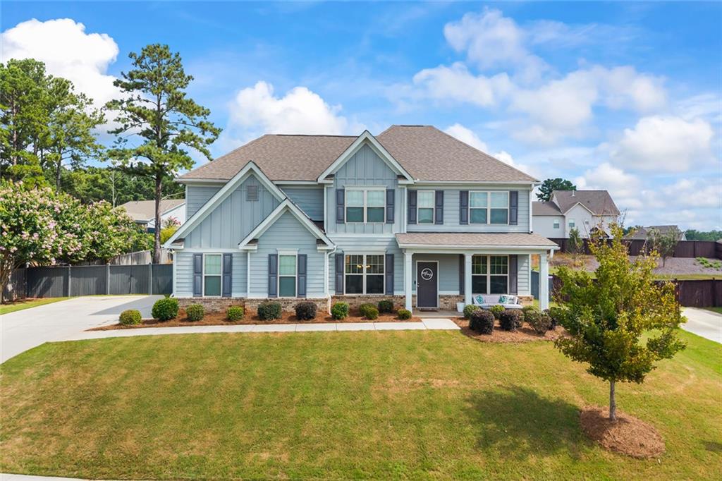 If you’ve been searching for a home that combines charm, comfort, and plenty of room to grow—this Highland Creek craftsman is it.
Upstairs, the oversized owner’s suite creates a true retreat, complete with plenty of space to relax and unwind.Three additional bedrooms and a large media room make the second floor perfect for family living, guests, or entertaining.
On the main level, you’ll find a dedicated office with custom built-in shelves.
Located in Monroe’s sought-after Highland Creek community, residents enjoy neighborhood amenities including a clubhouse for private events, a swimming pool, and tennis courts. This home offers the perfect balance of everyday comfort and lifestyle convenience.