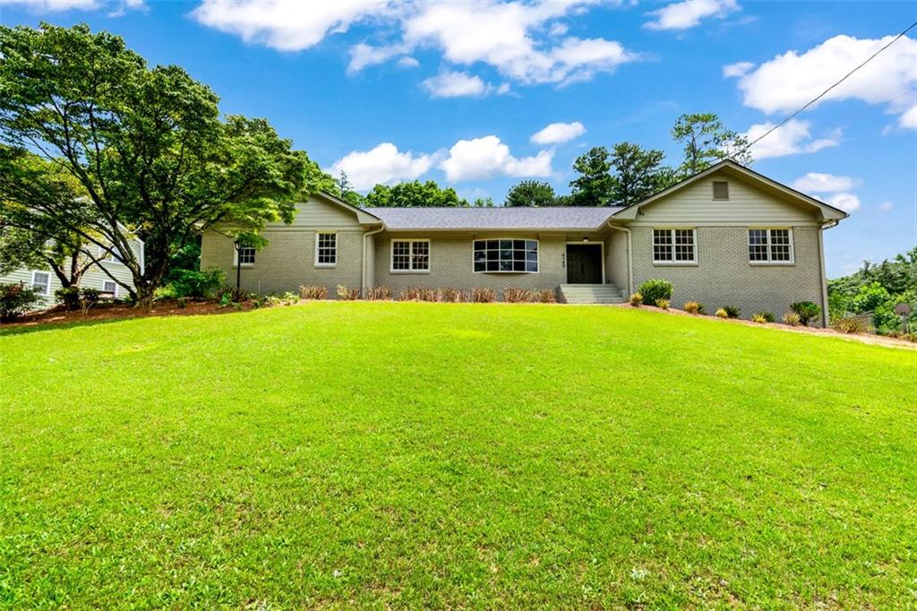 Welcome buyers! 4049 Northlake Creek Cove offers the perfect balance of modern upgrades, functional space, and timeless style — all set on a prominent corner lot in a quiet, established neighborhood with no HOA restrictions. This spacious 5-bedroom, 4-full bathroom home has been thoughtfully renovated from top to bottom, featuring premium engineered hardwood flooring throughout, a brand-new roof, new HVAC system, and new water heater, ensuring both style and peace of mind for years to come. Step into a sun-drenched main level with a flowing floorplan ideal for everyday living and entertaining. The heart of the home is a beautifully updated kitchen, which opens seamlessly into the dining and living spaces — perfect for hosting or keeping things cozy. The trimmed out Fireplace in the living room sets the tone for relaxation! Upstairs, the luxurious master suite is a true retreat. The spa-like en-suite bathroom stuns with elegant tilework, a large soaking tub, walk-in shower with custom glass panels, and double vanity — your own private retreat at the end of the day. The fully finished basement is a showstopper — complete with a full in-law suite, its own private entrance, a custom bar area, and a working brick fireplace, offering incredible flexibility for guests, multigenerational living, or entertainment space. Outside, the corner lot provides both curb appeal and usable yard space, ideal for gardening, play, or pets. Located minutes from Northlake dining, shopping, and easy highway access, this home checks all the boxes — updated, spacious, versatile, and with no HOA to limit your vision!