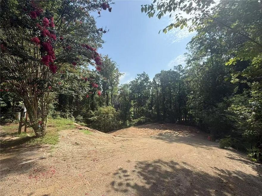 RARE OPPORTUNITY in WALTON HIGH SCHOOL District! Exceptional curb appeal on a QUIET CUL-DE-SAC LOT within the sought-after Mitsy Forest community, offering Swim & Tennis Club amenities. Prime East Cobb location convenient to top-rated schools, parks, shopping, dining, and more. Nearly 1 acre (0.92) of land—perfect to BUILD your custom dream home. The existing home has already been demolished—lot is cleared and READY TO BUILD!