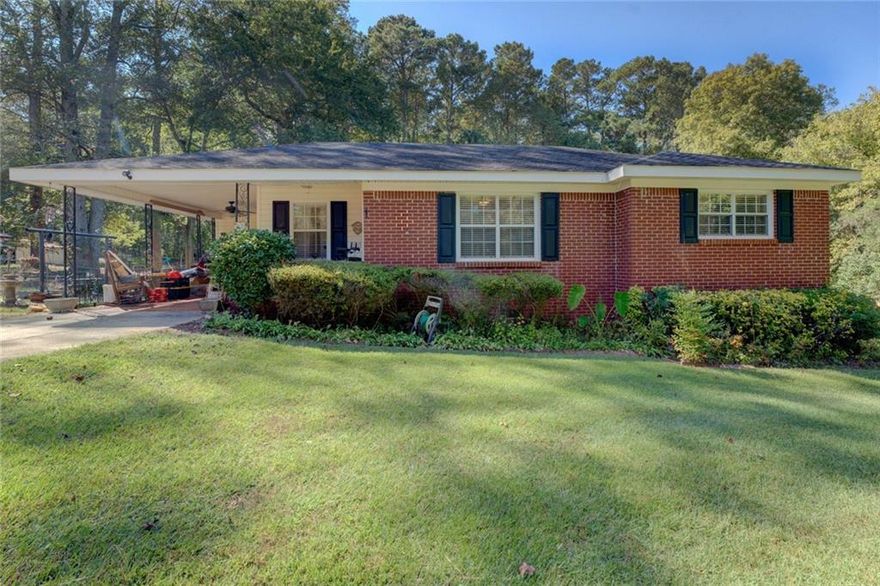 Check out this well-maintained ranch home, perfect for comfortable living and everyday convenience! Featuring an open-concept floor plan, this home offers a spacious living room, an eat-in kitchen, 2 bedrooms, and 1 full bath. Originally a 3-bedroom layout, one bedroom has been converted into a home office, providing flexible space to work or study from home. You'll love the hardwood flooring in the kitchen, living room, and office, tile flooring in the bathroom, and carpeted bedrooms for added comfort. Outside, enjoy a level, fenced backyard that is great for pets, play, or gardening plus two storage sheds. Conveniently located near I-20 for an easy commute, this move-in-ready home combines comfort, functionality, and location.