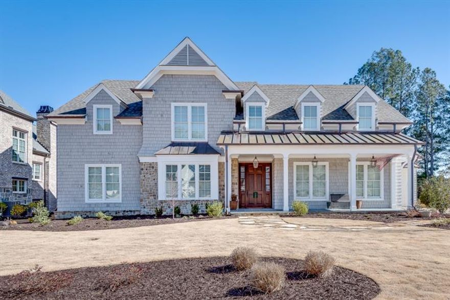 Indulge in the epitome of luxury living at The River Club, a gated golf club community, where resort-style living meets exquisite craftsmanship. This meticulously designed home, built by the Obie Award-winning builder Gus Pounds, seamlessly combines comfort, functionality, and stunning golf course views. Revel in the convenience of main floor living, featuring a thoughtfully designed owner's suite. Every detail has been meticulously planned for comfort and accessibility. The heart of this home is a stunning kitchen, seamlessly connecting to the living room. Enjoy culinary delights while immersed in breathtaking views of the adjacent golf course. Ascend to the second floor, where a spacious family room awaits, along with two bedrooms and two bathrooms. This private retreat offers versatility for family members or guests. The unfinished walk-in attic provides a unique opportunity for storage or future expansion. Tailor this space to your needs, whether for additional storage or to easily build out for a larger home.