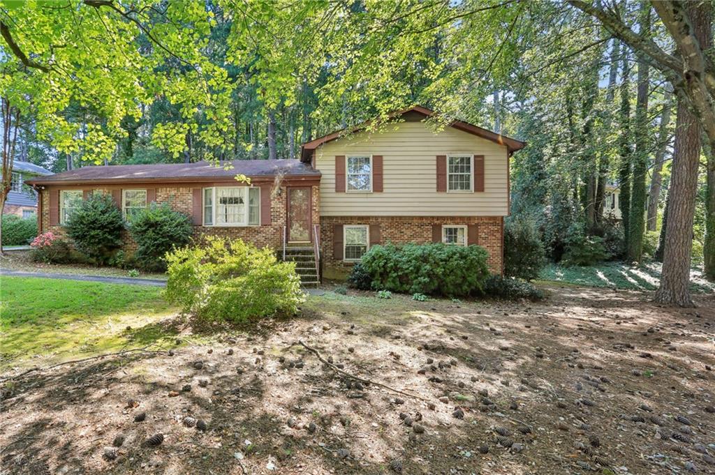 One owner home in the City of Tucker! Split level home on large corner lot with four bedrooms, two full baths, eat in kitchen, living room, family room with fireplace, unfinished basement area and double side entry carport. Enjoy the patio off the family room overlooking private backyard.
Lot Size: 99 X 128 X 190 X 209