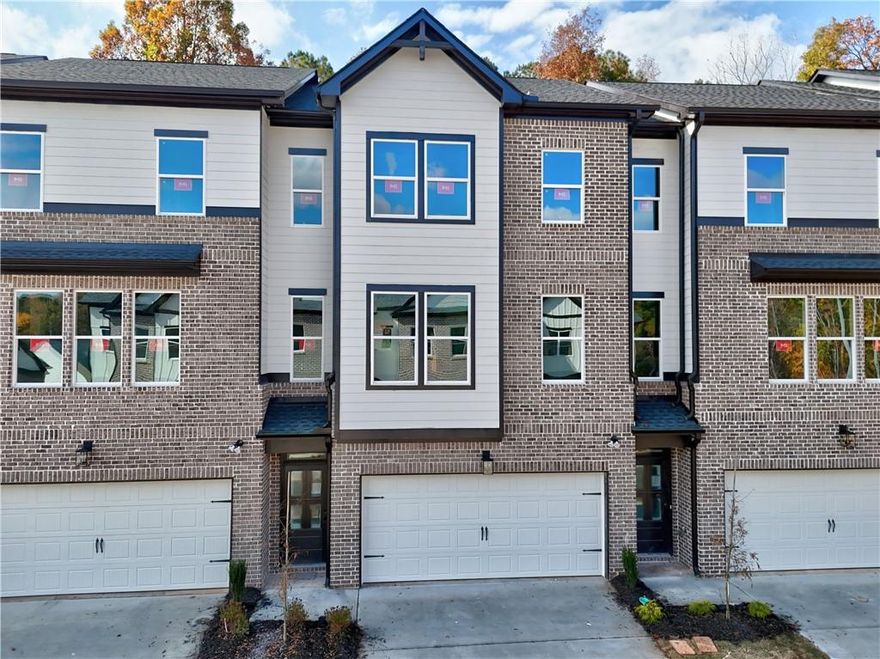 Richardson Housing Group – the Kinsley floor plan, a 5-bedroom design with a private covered back deck in the gated community of Parkstone Row in Tucker, GA. This exclusive 33-home neighborhood is ideally located just 12 miles northeast of Atlanta and offers quick access to I-85, I-285, and Highway 78, placing shopping, dining, parks, and local events all within convenient reach. Parkstone Row is also located in the highly regarded Parkview High School District, making it a top choice for buyers seeking quality schools and convenience. The homes in Parkstone Row feature a premium list of modern finishes that outshine the competition. Brick exteriors with cedar accents, 3/4 view front doors, and 30-year architectural-style shingle roofs create curb appeal and long-lasting value. Inside, you'll find designer kitchens with quartz countertops, shaker-style cabinetry, stainless steel appliances, subway tile backsplash, and pendant lighting over the island. High-end details continue throughout with 1x6 baseboard trim, 1x4 door casings, 1x4 window surrounds, 5-panel interior doors, flat-panel wainscoting in the foyer and dining area, black hardware and fixtures, oak site-finished stained hardwood stairs, and fully tiled master showers on the floor and walls with frameless glass doors. LVP flooring extends through the main level and continues upstairs in the common areas, providing both durability and style where it’s often overlooked. All 3 levels feature 9-foot ceilings, and the main level is enhanced by 6-foot-tall windows that fill the space with natural light. Each home also includes an electric vehicle charging outlet. HOA dues cover lawn maintenance, termite bond, and select exterior building maintenance, offering a low-maintenance lifestyle in a secure, gated setting. This home is under construction; photos of a finished home are not available for this floor plan. The photos shown are of the actual home currently listed for sale and will be updated as construction advances. Ask about up to $10,000 in closing cost incentives when using an approved lender, plus options for 100% financing or a 1% below-market interest rate.