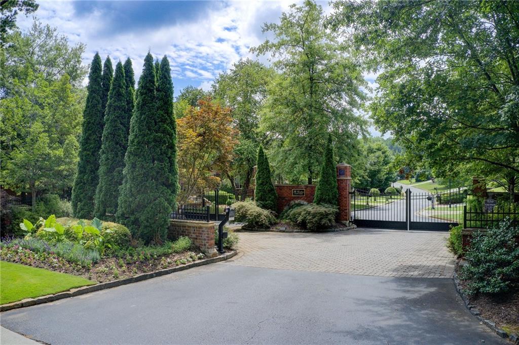 Back on the Market with Verified Buildability—Your Rare Opportunity for the Final Homesite in The Enclave at Jett Ferry. 3869 Teesdale Court is not just a lot with potential. It’s a prime buildable, investment-ready residential parcel ready for your custom luxury home in one of the most exclusive gated neighborhoods in Sandy Springs. Past listings lacked key facts about impervious, disturbance, and soil. We have them in specially-commissioned reports by survey firms. Compass Real Estate proudly presents this fully-qualified 1.49-acre lot with exceptional frontage of 180 feet in a coveted community known for its privacy, prestige, and natural beauty. Tucked at the end of a quiet cul-de-sac, this expansive lot offers the perfect blend of serenity and convenience. Enjoy uninterrupted views of the Chattahoochee Nature Preserve, surrounded by mature trees and lush landscapes. Unmatched backdrop for your personalized design in a central location. This exclusive neighborhood features just 36 homes of $1.5 million or more. Minutes from the Dunwoody Country Club, high-end shopping, and fine dining, with quick access to Sandy Springs, Roswell, Buckhead, and major interstates. Families will appreciate top-rated public and private schools nearby, along with recreational trails and parks that enhance your quality of life. Whether you envision a private retreat or a statement estate, this lot offers an oasis of space, setting, and prestige that can bring your dreams to life. Opportunities like this don’t come often. Bring your builder and secure your place in one of Atlanta’s most distinguished neighborhoods. 3869 Teesdale Court is READY, BUILDABLE, VALUABLE.