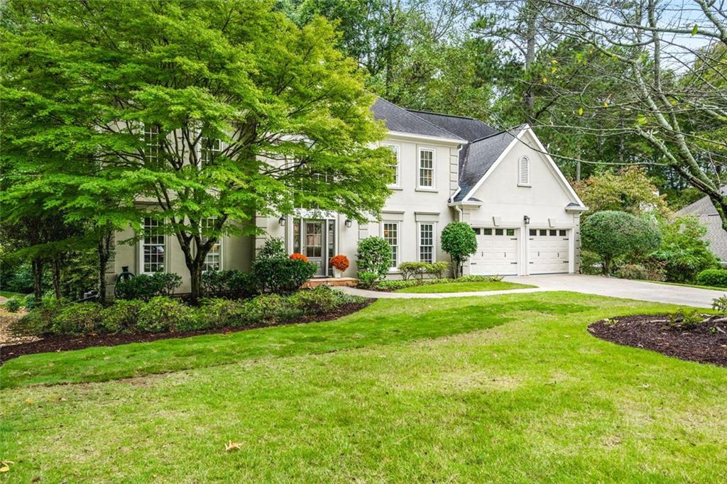 Exceptional North-East Facing Home in Hampton Woods – East Cobb’s Premier Swim & Tennis Community.
Discover this beautifully maintained hardcoat stucco home in Hampton Woods, one of East Cobb’s most beloved neighborhoods known for its active swim and tennis amenities, friendly neighbors, and top-rated schools.
Elegant & Inviting Living Spaces- Step into a grand two-story foyer that opens to a breathtaking great room with soaring cathedral ceilings, custom built-in bookshelves and cabinetry, a cozy fireplace, and dramatic two-story window that bathe the space in natural light and offer tranquil views of the trees beyond.
Designed for Entertaining, The formal dining room seats up to 12 guests with ease, while a separate formal living area adds sophistication to your entry. The open floorplan flows seamlessly from the family room to the breakfast area and kitchen, connected by elegant French doors. The kitchen features white cabinetry, granite countertops, and new built-in oven and microwave. French doors from the breakfast area lead to a spacious deck—perfect for hosting gatherings or enjoying quiet mornings outdoors.
Private Owner’s Retreat- The owner’s suite is a true sanctuary, offering a large bedroom with a separate sitting room or office drenched in natural light. The resort-style bathroom includes a soaking tub, separate shower, dual vanities, and two toilets for added convenience. Generously sized secondary bedrooms feature updated bathrooms and ample closet space, ideal for family or guests. Large bedroom and bathroom on main for guests.
Versatile finished terrace level offers a large open space perfect for a media or family room, complete with built-in cabinetry. Additional rooms include a recreation/craft room, billiard room, and a private bedroom with full bath—ideal for guests or multi-generational living.
The perfect Outdoor Oasis: Step outside to a level backyard with a grassy play area, stone firepit, and a charming playhouse—a peaceful retreat for all ages.
This Prime Location of Hampton Woods known for its community events, welcoming atmosphere, and proximity to nature trails, shopping, dining, and major highways including GA-400, I-75, and I-285. Minutes from Sandy Springs, Roswell, and located in some of Georgia’s top-ranked schools, this home offers the perfect blend of luxury, lifestyle, and location.
(P.S. There is a secret storage room accessed from the mirrored closet in the terrace level bedroom-not to be missed!)