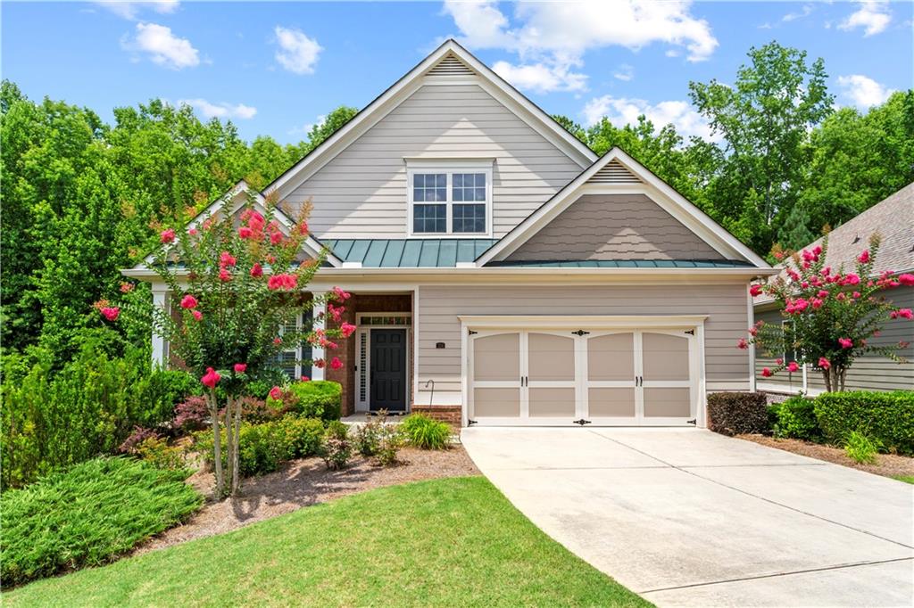 Welcome to the charming lifestyle offered at The Orchards of East Cherokee. This beautifully appointed ranch-style home features a fully finished basement, providing single-level living along with ample additional space designed with elegance in mind. Throughout the home, you'll find exquisite crown molding and hardwood floors. The stunning open-concept kitchen includes a pantry, and the home boasts spacious rooms, including a laundry room. A two-car garage with epoxy flooring adds to the convenience. An inviting sunroom and back deck overlook a lovely yard adorned with a serene wooded backdrop, while the lower level offers a screened-in outdoor living area of its own. You don't want to miss the delightful combination of comfort and style this home has to offer!