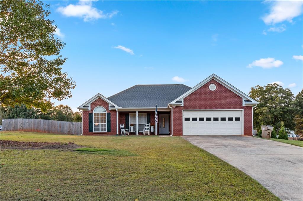 Welcome to 1016 Easy Street in charming Winder! This delightful home offers a perfect blend of comfort and convenience. Nestled on a large, level lot, the property features a spacious fenced backyard, perfect for outdoor activities and relaxation. Inside, you'll find an open floor plan that creates a seamless flow between living spaces, complemented by vaulted ceilings that add a touch of elegance. The home also boasts walk-in closets for ample storage and a large covered patio, perfect for entertaining or enjoying peaceful evenings outdoors. Don't miss the chance to own this beautiful retreat in a friendly community!