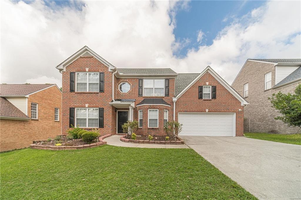 Welcome home to this move-in ready, 4-bedroom, 2.5 bathroom, 3-sided brick beauty! Upon entry you will see a formal living/flex room on the left and separate dining room with bay window on the right that flows into the bright kitchen with 42” white cabinets, granite countertops, subway tile backsplash, smooth top stainless-steel range, stainless-steel refrigerator, built-in stainless-steel microwave, breakfast bar, pantry and eat-in area and is completely open to a spacious family room with marble surround auto-start fireplace. The half bath and laundry room completes the main floor. Rear staircase takes you upstairs to the primary suite with deep tray ceiling, sitting area, walk-in closet, double sink vanity, garden tub, and separate shower. Bedrooms 2, 3 & 4 are spacious, have ample closets and share a full tiled bath and linen closet. Great outdoor space includes patio and private yard. NEW ROOF! Top of the line, large load LG Thinq stainless-steel washer & dryer included with the purchase of the home. This home is located in a community with great amenities including a pool, playground, and sidewalks. Schedule your tour today!