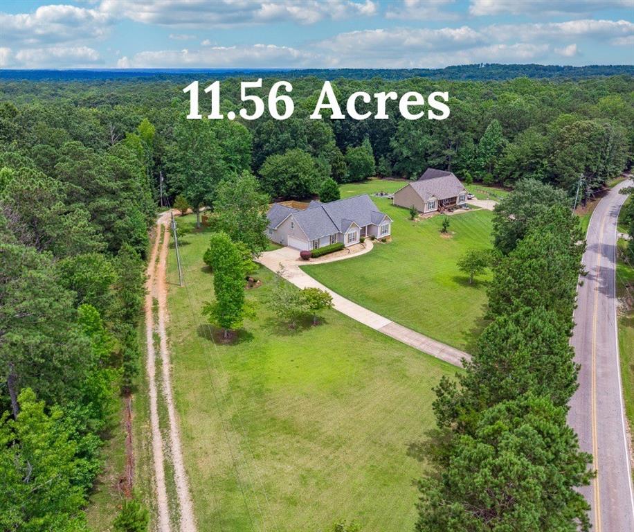 Welcome to a rare ranch offering space, versatility, and charm like no other. Set on a picturesque 11.5-acre tract of open pastureland, this beautifully updated estate features a fully renovated main house, a massive 24x48 barn/garage with a kitchenette, and a separate livable trailer with its own driveway—ideal for income-producing potential or multi-generational living.
The main house has just undergone a stunning transformation, showcasing brand new flooring, fresh paint throughout, updated bathrooms, and a fully modernized kitchen. A spacious master suite anchors the home, complete with oversized closets and a luxurious ensuite bath. Two additional bedrooms and a full bath round out the main level, while upstairs you’ll find a generous bonus room and plenty of unfinished space for future expansion or storage.
Step outside to enjoy the newly built, partially enclosed deck overlooking a private, fenced backyard—perfect for kids, pets, or just enjoying peaceful afternoons in your own secluded oasis. The land surrounding the home is truly breathtaking, offering a rare blend of usability and privacy.
Just beyond the backyard sits the large barn/garage, ideal for storage, hobbies, a workshop, or even conversion into more living space. The additional livable trailer, privately tucked away with its own entrance, provides the perfect opportunity for rental income, a guest house, or a home office setup away from the main residence.
Whether you’re seeking a homestead, a mini-farm, an investment opportunity, or simply room to breathe—this property has it all. Homes like this don’t come around often.