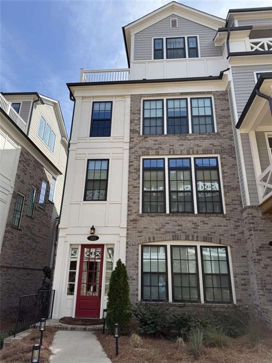 Location, Location, Location plus Upgrades Galore! This 4 bd/4.5 ba townhome is just over 2.5 years old and in mint condition. Starting on the first floor with custom mirrored sliding doors in the foyer accessing the first floor bedroom and bathroom with custom built-ins including the closet and mudroom bench seating. Skybar! Fantastic place to unwind no matter what the weather in a partially covered deck and open air section with composite decking and astroturf. This lovingly kept home has upgrades throughout, including a single 11+ foot quartzite natural stone countertop on the bar in the kitchen with walkout deck for grilling or eating al fresco. Custom built pantry shelves for amazing use of the space. Built out storage on the fourth floor with custom cabinetry, granite countertops and built-in desk. Beautifully appointed bathrooms with tile selected by an interior designer and installed glass doors on bath tubs. Massive tub for two in the master bathroom with glass subway tiles lining the walk-in shower! This is too good to pass up for this end cap unit that is filled with light. A short walk to either Avalon or downtown Alpharetta!