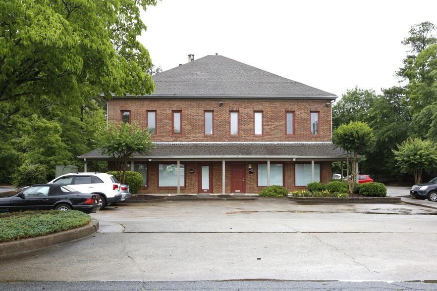 IMPROVED LEASE RATE! FIRST FLOOR OFFICE - This open, 500 sq ft suite offers a very spacious office with abundant built-in shelving, a private restroom and huge windows providing tons of natural light. The small separate records room, or possible tech closet, provides additional storage. Plenty of parking on site. Very conveniently located just off Holcomb Bridge and Grimes Bridge Road .("Road front ft" is estimate.) Call to schedule a showing today!