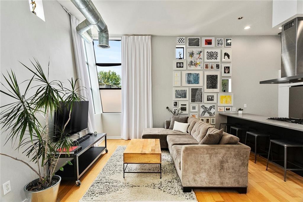 *6 Months Prepaid HOA Dues w/ Accepted Contract that Closes on or Before November 15, 2024. Fantastic Opportunity to Live in Hot Grant Park in Highly Sought-After City Space Lofts Directly Across from Historic Oakland Cemetery w/ Massive Private Rooftop Entertainment Deck w/ 360-Degree Skyline Views + Integrated Deck Lighting Perfect for Al Fresco Dining, Sunset Cocktails, Game Day, Gardening + Relaxing & Literally Steps from All Things Intown! This Coveted 3 Level, Fully Renovated Light-Filled Designer Residence Exudes Clean & Chic Vibes & Has it All - Brand New Luxe Bathrooms, Fresh Paint Throughout, Designer Lighting + Plumbing Fixtures, Recessed Lighting, Brand New Carpeted Bedrooms, Tankless Water Heater, 2 Outdoor Spaces + Private 2-Car Garage in Gated Community. The Thoughtfully Laid Out Open Concept Floor Plan Boasts Quintessential Contemporary Design Throughout w/ Soaring 15+' Ceilings, Exposed Ductwork, Hardwoods & Oversized Windows (w/ Custom LEVOLOR Shades + Drapery) for Abundant Natural Light. Stunning Eat-In Chef's Kitchen Open to Living & Dining w/ Island, Custom Wood Cabinetry w/ Soft-Close Drawers + Subway Tile Backsplash, True Pantry, Recessed+Under Cabinet Task Lighting, Quartz Counters & Bosch S/S Appliances w/ 5 Burner Gas Range + Vent Hood. French Doors Lead to an Entertainment Patio off Family Room/Kitchen. Powder Room on Main. Spacious Primary Suite w/ Walk-In Closet & Modern Spa-Like Bath w/ Double Vanity, Sleek Frameless Walk-In Glass Shower w/ Textured Shower Walls + Luxe Free-Standing Soaking Tub. Secondary Bedroom w/ En Suite w/ Walk-In Shower + Vanity w/ Quartz Counters. Laundry Up w/ Stackable Samsung Washer+Dryer (Included). **This is the Only Single Family Home within the Boutique, Gated+Controlled Access Community of Only 15 Residences. SmartHome w/ Smart Thermostat & Keyless Entry. Located in the Heart of Grant Park, 307 Cherokee has a Walk Score of 92 & is Centrally Located w/ Literally Everything at Your Fingertips - Cabbagetown, Fetch Park, the BeltLine, Krog Street Market, Inman Park, the Best Dining/Entertainment Options (DAS BBQ, Ria's Bluebird, Grant Park Market & More All Within 1-2 Blocks Away) & MARTA. Minutes to Downtown, Midtown, I-20 & I-85.