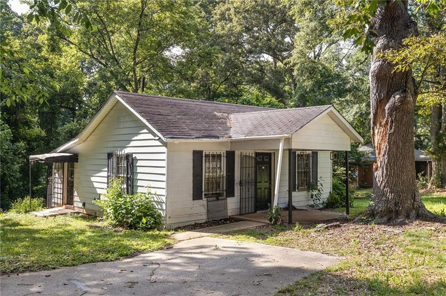 Tucked back on a tree-filled lot, this one-bedroom home serves up space and privacy in a way that’s hard to find at this price point. The oversized living area provides room to relax, and the kitchen is big enough to actually cook in, with laundry tucked just off to the side and easy access to the yard. Whether you're a first-time buyer looking to make it your own or an investor adding to your real estate portfolio, this home sits on just over a half acre. Your potential is limitless.