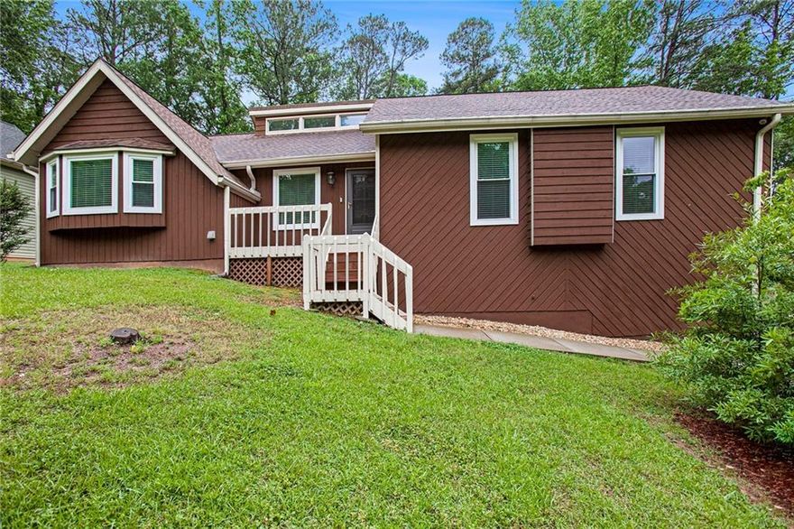 Located just minutes from Blackwell Rd and Ebenezer Rd in Marietta, GA, this spacious home offers a well-designed layout with both comfort and functionality. The main level features well-maintained wood floors, a bright fireside living room with soaring ceilings and recessed lighting, a separate dining room, and an eat-in kitchen with stained cabinets, granite countertops, stainless steel appliances, recessed lighting, track lighting over the sink, and a cozy breakfast nook. New HVAC systems and a newer roof. You'll find three bedrooms and two full bathrooms on the main level, including the primary ensuite with a double vanity, tub/shower combo, and a spacious walk-in closet. The finished basement provides excellent additional living space, and a recreation room—perfect for a teen suite, guests, hobbies, or entertaining and a full bathroom with heated floors and plumbing hookup for a kitchenette is already done. The 2-car garage is also conveniently located on the lower level. Just off the living room, step outside to a screened-in covered porch that offers a peaceful space to relax and enjoy the outdoors. Over 2800 sq ft of living space waiting to be enjoyed. Discounted rate options and no lender fee future refinancing may be available for qualified buyers of this home.