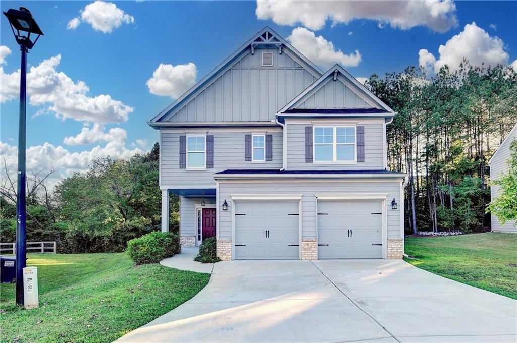 This impressive residence boasts a thoughtful design, expertly blending modern amenities, energy efficiency, and comfort. The incorporation of smart living features, including LED lighting, ceiling fans, 9 ft ceilings on the main level, and a monitored security system, redefines the living experience. As you enter, you'll be greeted by an expansive open-concept living area, where the kitchen takes center stage, complete with a large walk-in pantry, granite countertops, and a breakfast bar. The kitchen seamlessly connects to the family room, featuring a cozy fireplace. The breakfast/dining room provides effortless access to the patio. The upstairs area is distinguished by a generously sized owner suite, complete with an oversized primary suite showcasing an elegant tray ceiling. The luxurious primary bath boasts double vanities, a tile shower, and a spacious walk-in closet. In addition to the primary bedroom, there are three generously sized secondary bedrooms. For added convenience, the laundry room is conveniently located upstairs. Throughout the first level, durable and stylish LVP flooring enhances the clean, modern aesthetic. This exceptional residence masterfully blends space, style, and cutting-edge features, making it the ultimate move-in-ready home. Seller is Motivated.