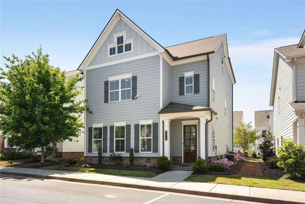 Discover this nearly-new, beautifully designed home that blends modern style with everyday comfort—perfectly located in the heart of Smyrna, GA. Just steps away from Smyrna Market Village, Belmont Village, Fox Creek Golf Course, neighborhood parks, local restaurants, and Adams Pond, you’ll love having everything you need within walking distance.
Inside, you’re welcomed by an open, sunlit floor plan with rich hardwood floors and upscale finishes throughout. The stunning gourmet kitchen is built for both weeknight dinners and weekend entertaining, featuring a custom vent hood, quartz countertops, a spacious island, stainless steel appliances, a walk-in pantry, and one of two beverage coolers.
Upstairs, the serene primary suite is your personal retreat with a custom walk-in closet and spa-inspired bathroom with a glass-enclosed shower and double vanities. A versatile landing area works perfectly as a home office, playroom, or cozy reading nook.
The third level offers even more flexibility with a large family room, an extra bedroom, and a full bath—great for hosting guests, a roommate, or a multigenerational setup. A stylish custom bar with sink and a second beverage cooler is ready for movie nights, game days, or casual get-togethers.
Out back, relax in the fenced yard or enjoy coffee on the private patio. A two-car garage with an EV charging station adds convenience for modern living.