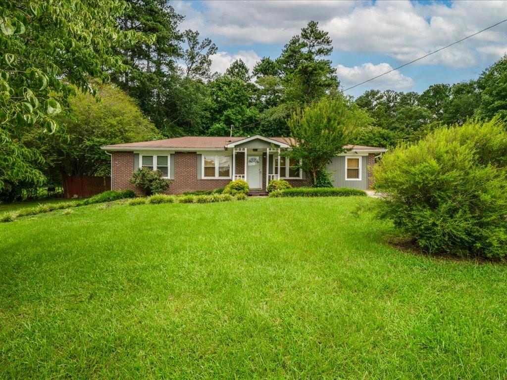 Welcome to one of the most beloved neighborhoods in town, where long-time owners stay for decades and newcomers quickly feel at home.
This classic all-brick ranch sits on nearly half an acre, giving you the space and privacy everyone wants but rarely finds. The level, fenced backyard is perfect for summer barbecues, games of catch, or unwinding on the patio with friends. Out front, the covered porch is made for slow mornings with coffee in hand. You will also find a large, well-maintained shed out back, ideal for storage, hobbies, or a future workshop.
Step inside to an oversized living room with gleaming hardwood floors that flow throughout. The renovated kitchen (2019) is a standout, featuring granite countertops, stainless steel appliances, and rich cherry cabinets that make cooking feel like a treat.
The primary suite offers a rare bonus for the neighborhood: a walk-in closet and private half bath. Two spacious secondary bedrooms share a hall bath accented with timeless beadboard.
This is a home with character, thoughtful updates, and plenty of extras to enjoy.
A sunny bonus room offers flexible space and convenient access to laundry with washer and dryer included. Need extra storage? There’s a dedicated shed in the backyard for all your tools and toys.
Don’t miss this quintessential 1960s brick ranch—it’s full of character, function, and pride of ownership!