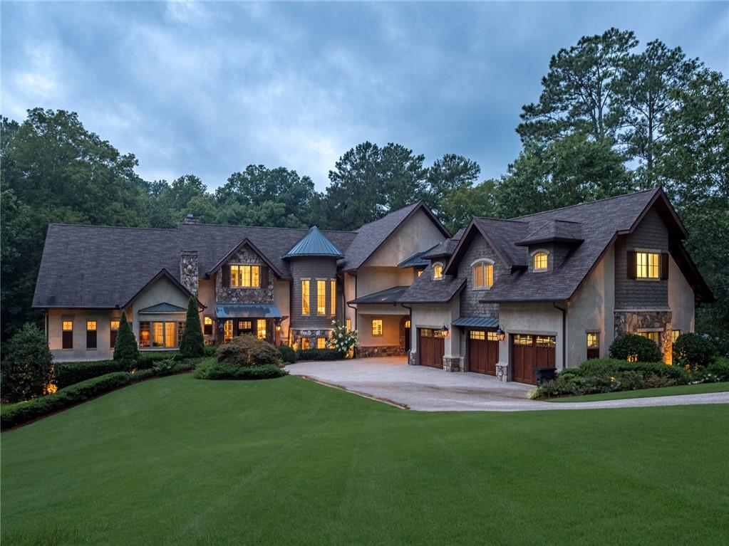 Imagine coming home to your own private 2+ acre estate with beautiful rolling front lawn and every amenity imaginable. Nestled on a quiet street, this home will wow you from your first step inside. The entry foyer with groin ceiling opens to the living room where huge windows lead your eye out to your own private playground. Pool and Spa, Covered porch with fireplace and built in grill, Sport court, Custom chicken coop, Walking trails that wind through the property, and finally work on your short game with your own 4 hole course with tee boxes ranging from 15-40 yards to the putting green. Back inside on the main floor, a true chef’s kitchen awaits with double islands, matching full size Sub-Zero refrigerator and freezer, double ovens, gas cooktop, and hand hammered copper sink. The family room with its soaring beamed ceiling and stone fireplace is conveniently located adjacent to the kitchen. The elegant living room showcases a limestone fireplace which leads to the formal dining room with double butler’s pantries and sliding doors to the balcony overlooking the pool. The main level owner’s suite with fireplace will make for a perfect cozy morning spent looking out into the backyard. Wood paneled study with fireplace and built in bookshelves, large laundry room with office, and two half baths complete the main floor. Upstairs are three large en-suite secondary bedrooms, an upstairs laundry, gift wrapping room, and huge guest suite with private bath and large living area. In addition, the terrace level is where the fun begins! Game room, movie theater, full gym, wine cellar, kitchen, golf simulator, dog wash and gathering area with stone fireplace will make you never want to leave! This is a home that needs to be seen to be truly appreciated!