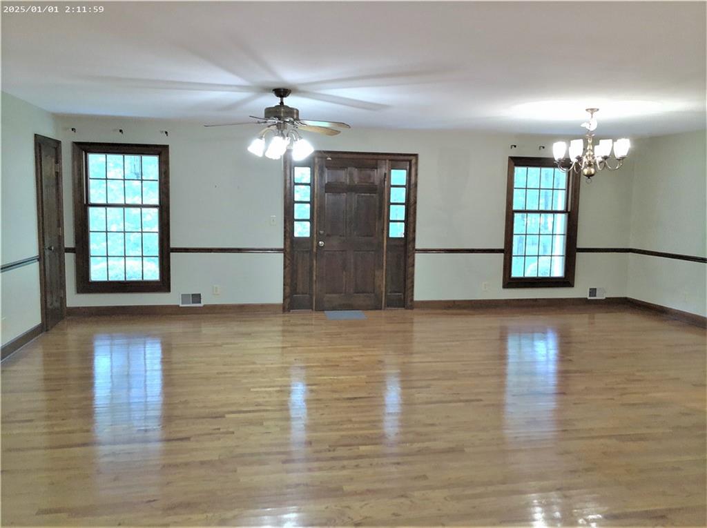 Welcome to this well maintained spacious all brick ranch home on your private oasis of 10 useable acres,. Only 2.3 miles from the interstate yet hidden up the hill in the wooded pasture. Inside offers beautiful hardwood floors, an eat-in kitchen,and an oversized primary suite. The formal dining room and living room with fireplace is great for entertaining. There is a large laundry room off of the country style kitchen with ample cabinet /counter space and stainless steel appliances. As you step out the back door, you can enjoy evenings on the screened porch overlooking the wildlife and changing seasons. Outside you will find a two car attached garage and detached single garage, fenced in pasture areas, deer stands, all while being minutes from the interstate. Close to shopping and dining and quick commute to the airport.